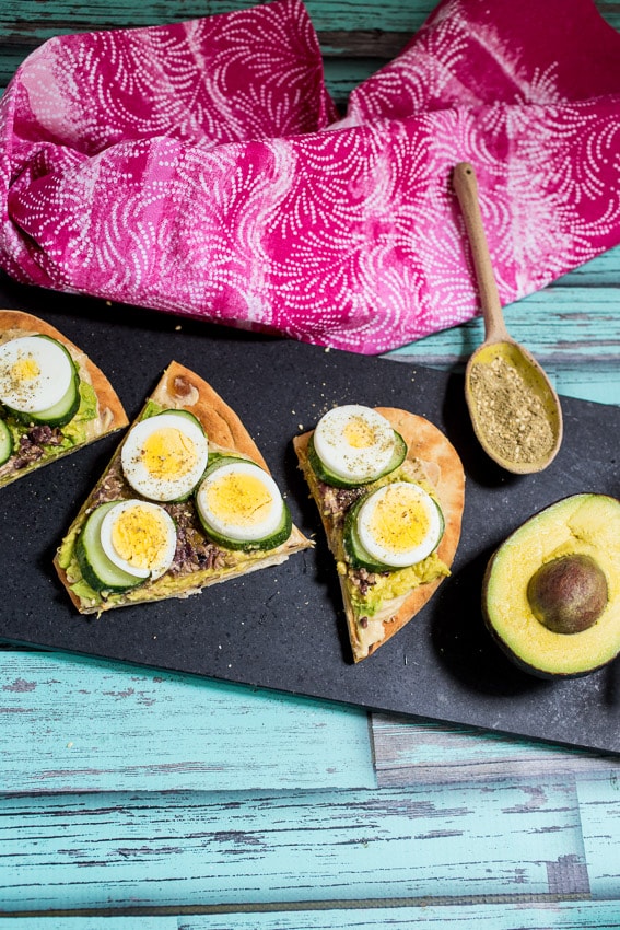 Avocado Egg and Cucumber Hummus Toast | girlinthelittleredkitchen.com