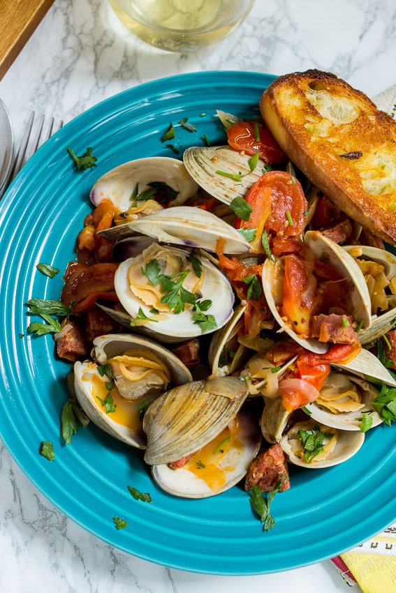 Steamed Clams with Chorizo and Tomatoes | girlinthelittleredkitchen.com