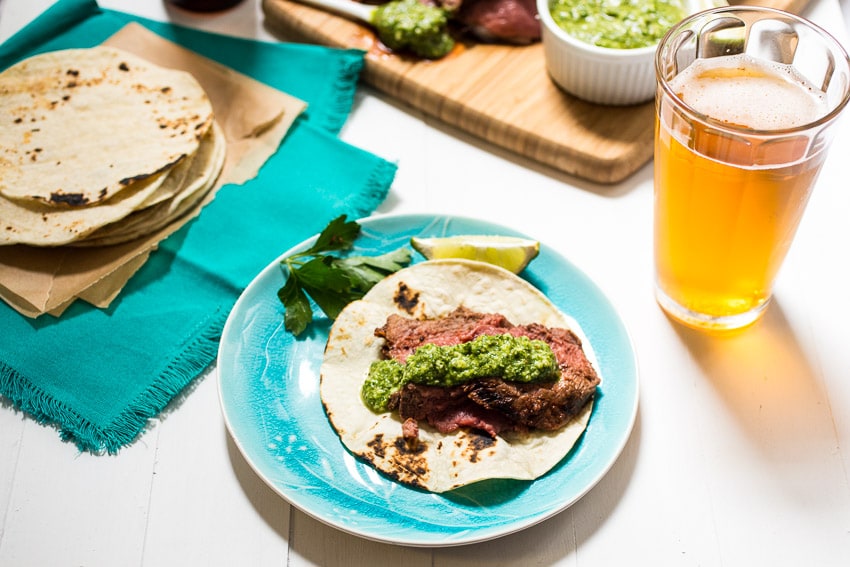 Beer Marinated Ancho Chili Spiced Lamb  with Cilantro Pesto | girlinthelittleredkitchen.com