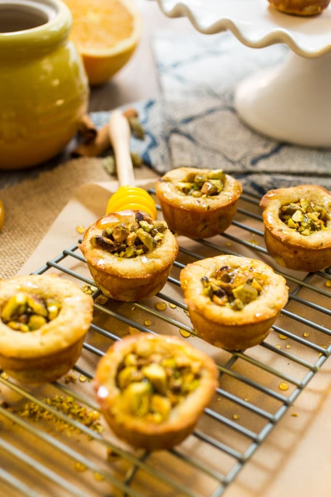 Baklava Cookie Cups from The Girl In The Little Red Kitchen | Honey cookies are packed with pistachios and a spiced honey syrup for a delicious take on traditional baklava. 