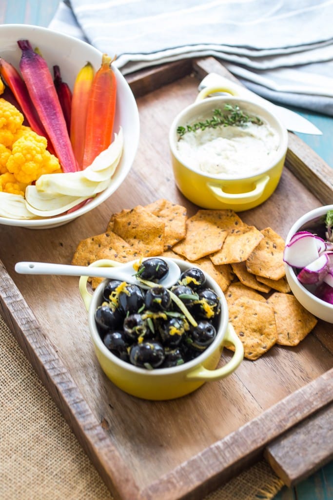Thanksgiving Relish Tray from The Girl In The Little Red Kitchen | A modern take on the relish tray with homemade pickles, a goat cheese spread and flavor packed black olives. 
