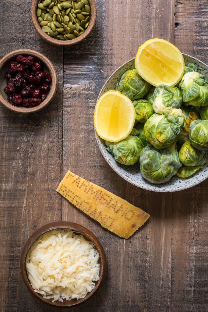 Brussel Sprouts Salad with Cranberries, Pepitas and Parmesan | girlinthelittleredkitchen.com