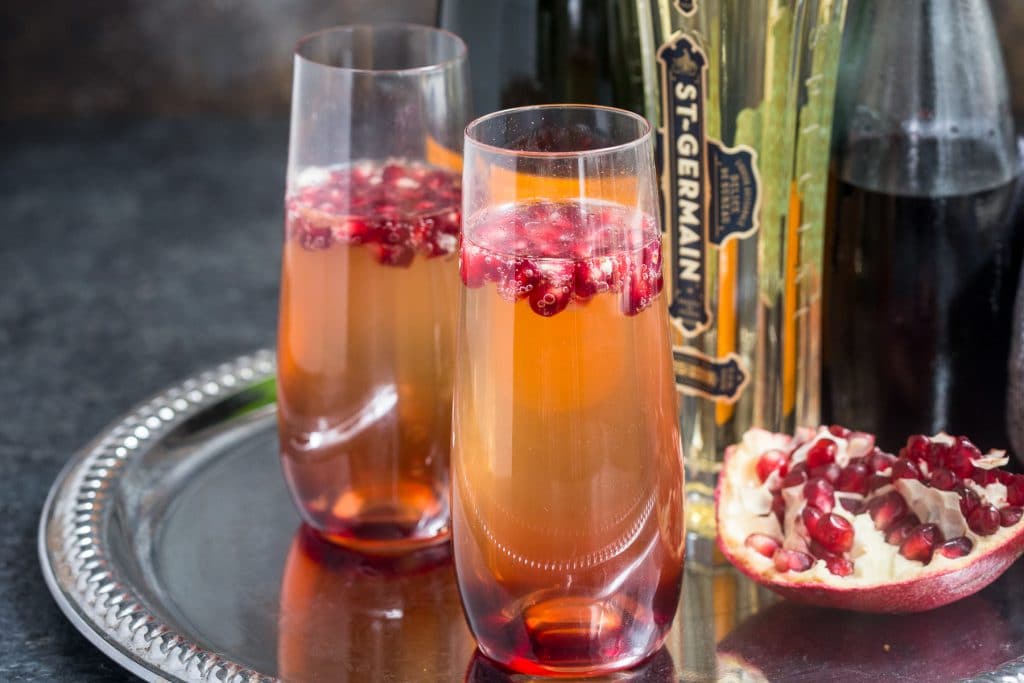 St. Germain and Pomegranate Champagne Cocktail | girlinthelittleredkitchen.com
