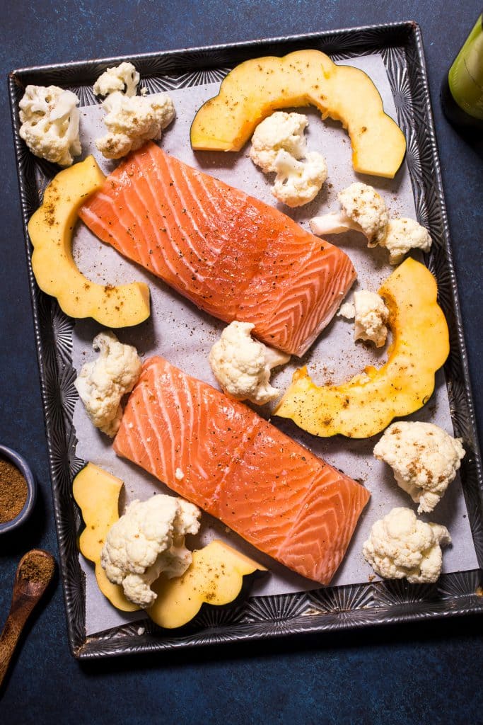 Sheet Pan Salmon with Garam Masala Squash and Cauliflower | girlinthelittleredkitchen.com