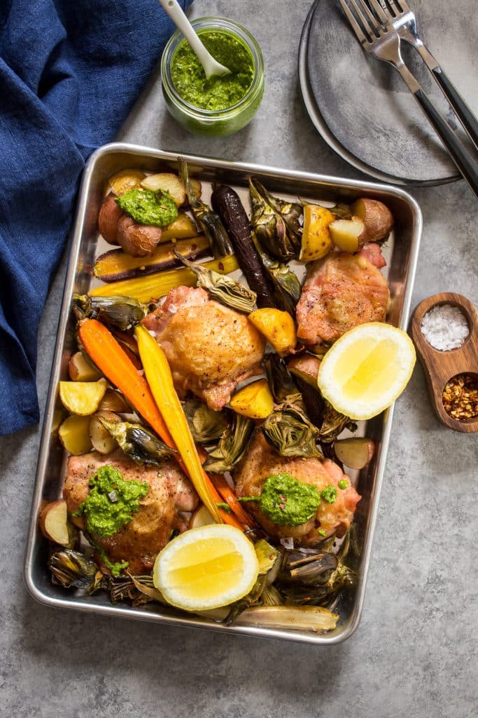 Sheet Pan Chicken Thighs with Artichokes and Carrots | girlinthelittleredkitchen.com