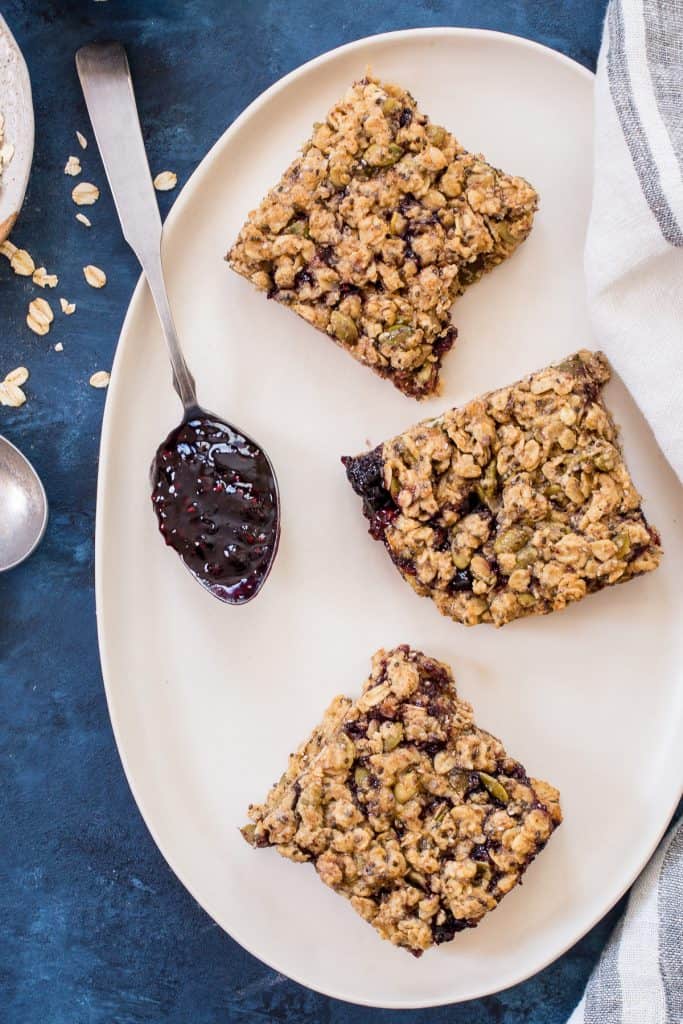 Oatmeal Breakfast Bars with Almond Butter and Jam | girlinthelittleredkitchen.com